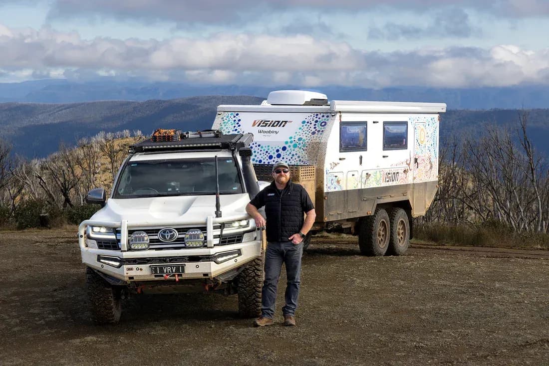 Chris Michel with LandCruiser and Vision RV Waabiny in the Victorian High Country